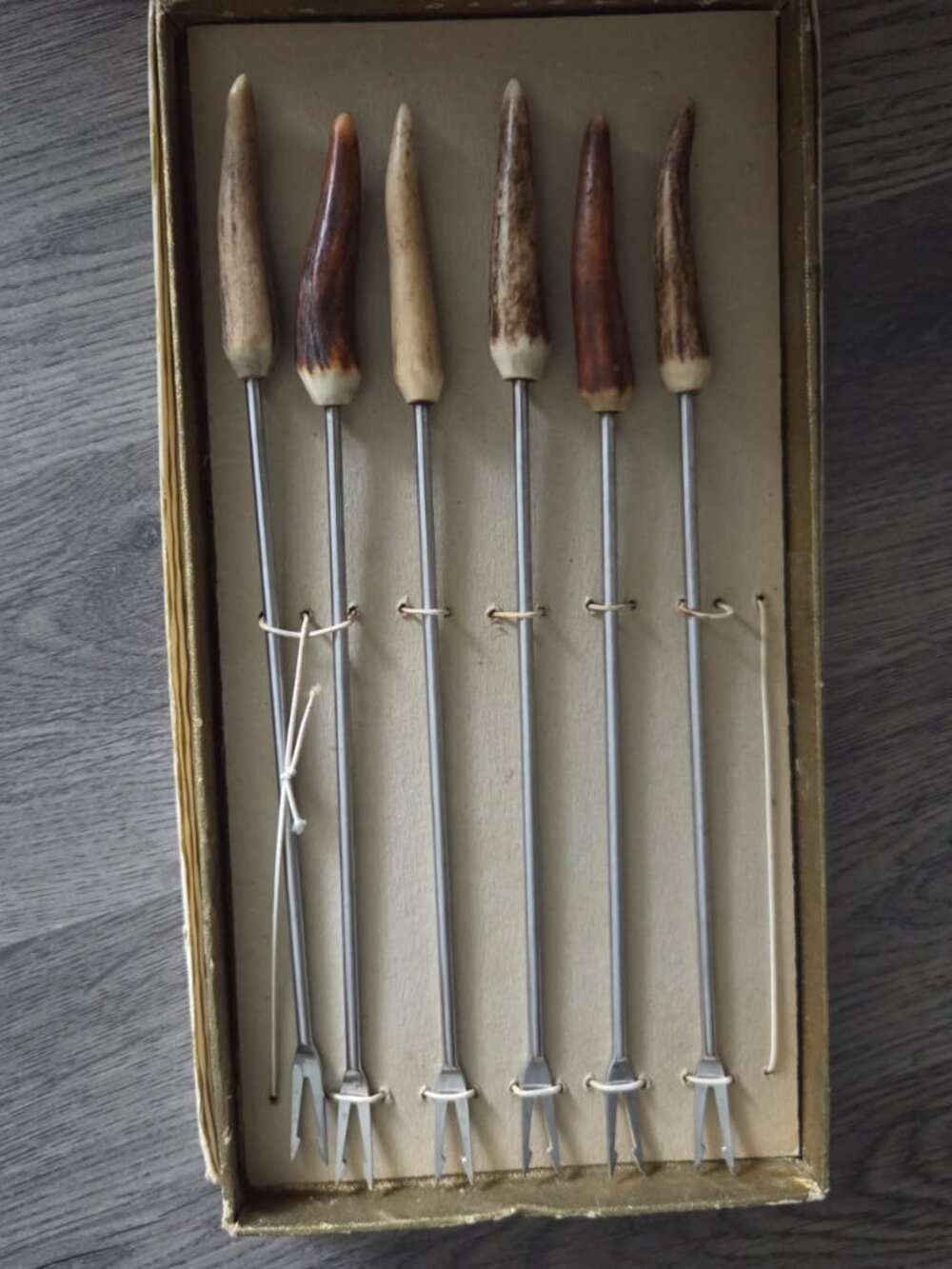 Vintage Fondue fork set features handles crafted from deer antler